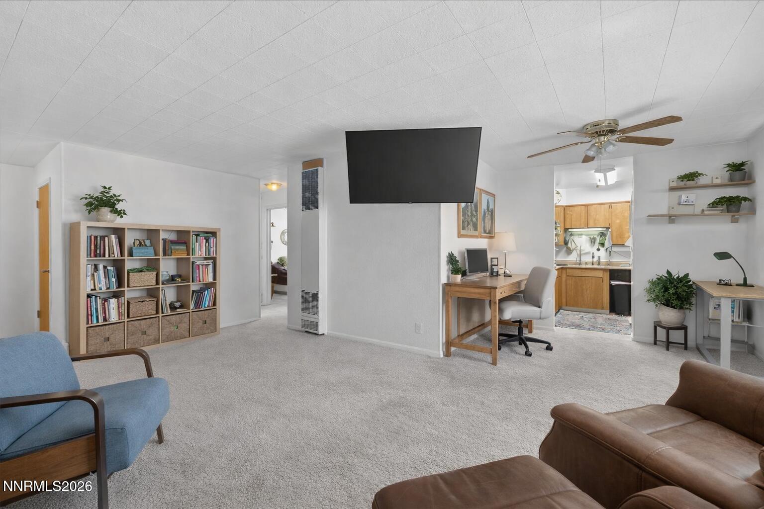 1945 4th Street, Unit 3 Sparks, NV 89431 - Photo 6 of 20 a living room with furniture and a flat screen tv