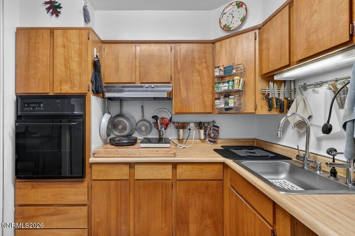 1945 4th Street, Unit 3 Sparks, NV 89431 - Photo 9 of 20 a kitchen with stainless steel appliances granite countertop a sink a stove and a refrigerator
