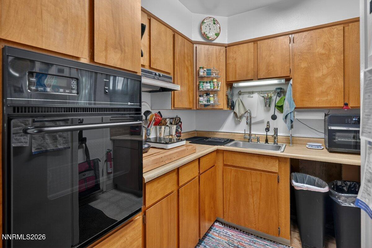 1945 4th Street, Unit 3 Sparks, NV 89431 - Photo 10 of 20 a kitchen with stainless steel appliances granite countertop a sink stove and cabinets