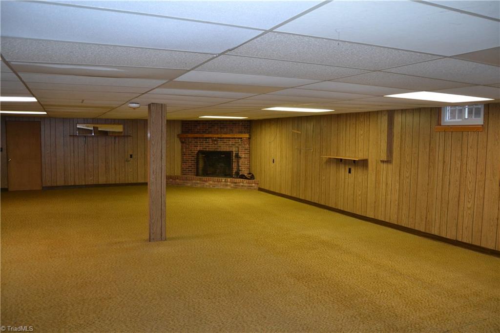 4758 Old Greensboro Road Randleman, NC 27317 - Photo 13 of 23 Finished Basement with Wood Burning Fireplace
