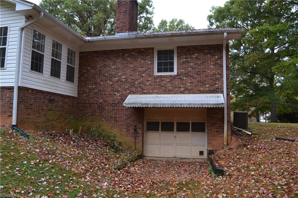 4758 Old Greensboro Road Randleman, NC 27317 - Photo 19 of 23 Garage Door into unfinished basement area.