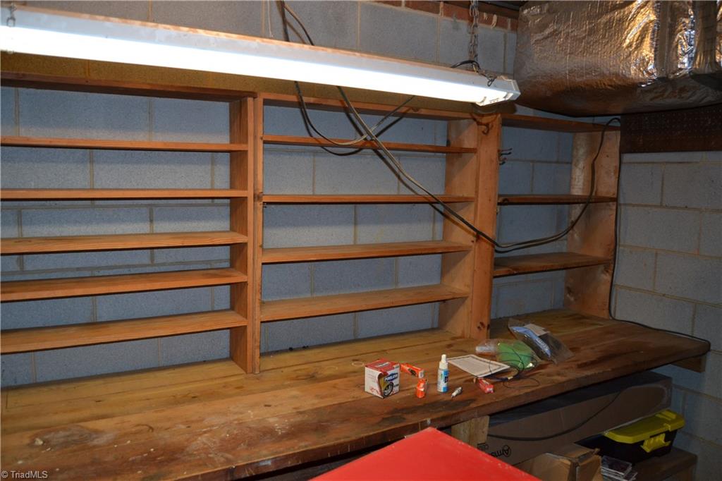 4758 Old Greensboro Road Randleman, NC 27317 - Photo 21 of 23 Workshop in unfinished basement area