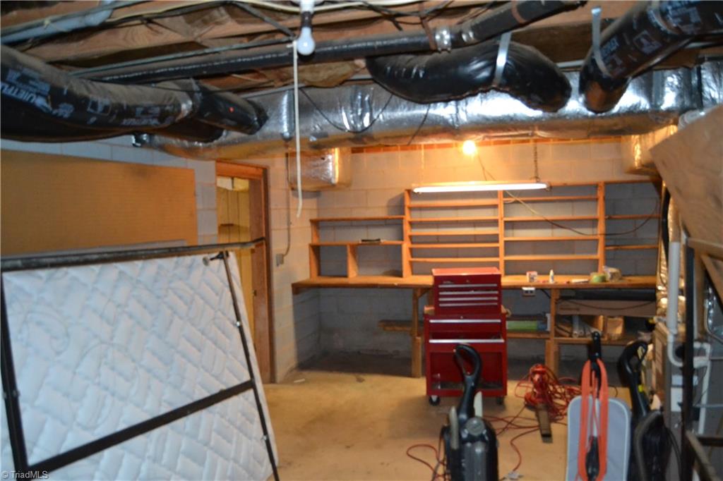 4758 Old Greensboro Road Randleman, NC 27317 - Photo 23 of 23 Workshop in unfinished basement.