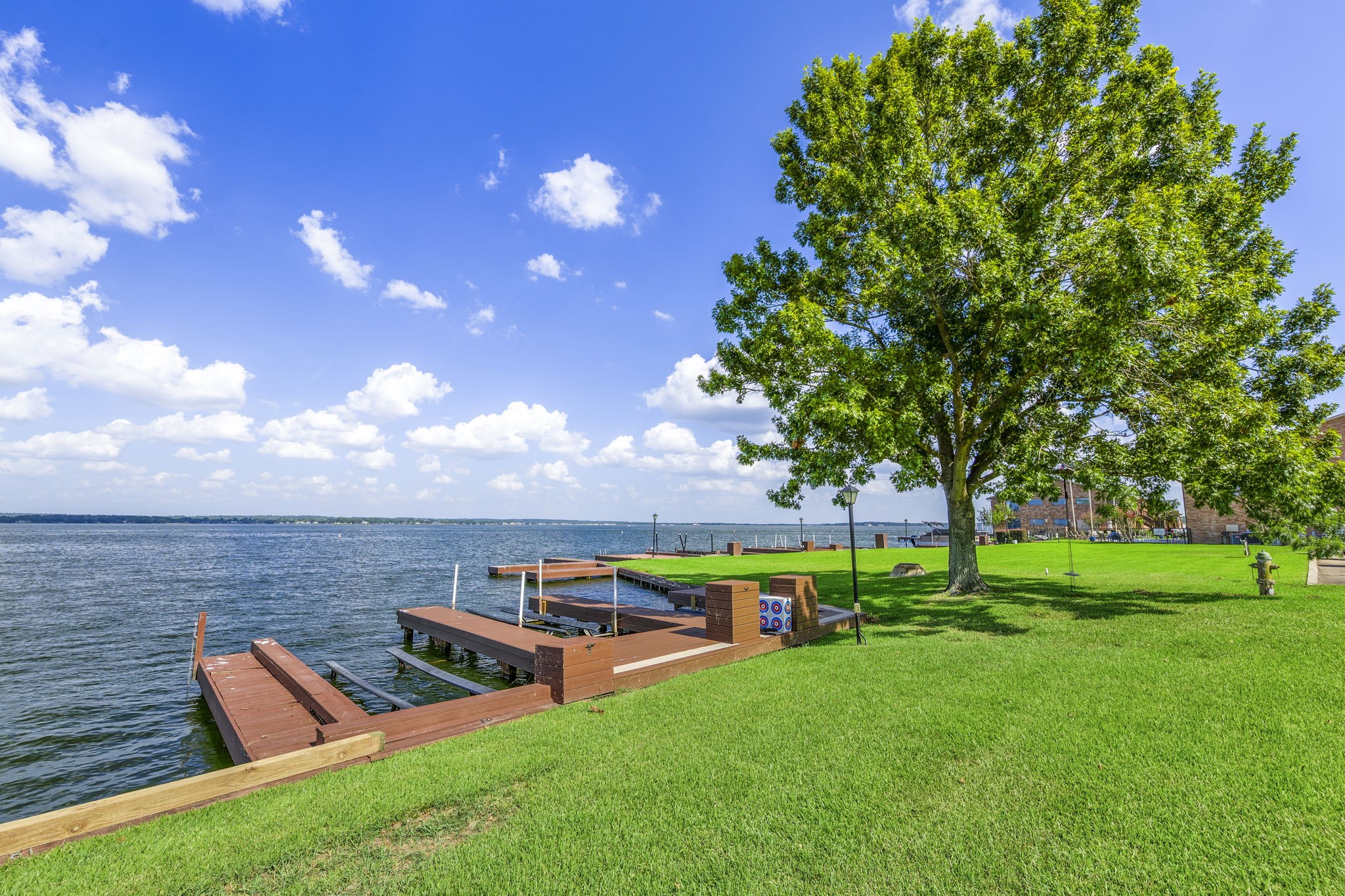 801 River Road, Unit 105C Montgomery, TX 77356 - Photo 26 of 30 Enjoy a quiet stretch of green space that opens to your private boat slip, complete with a boat lift for easy access to Lake Conroe.
