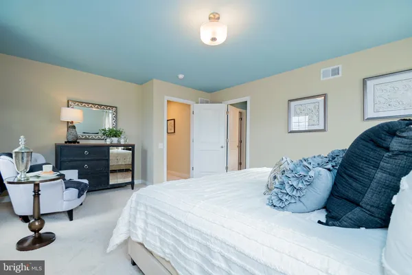 a bedroom with a bed and furniture