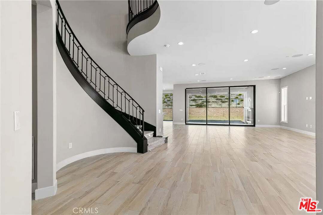 20517 Deer Grass Court Porter Ranch, CA 91326 - Photo 11 of 75 a view of an entryway with wooden floor
