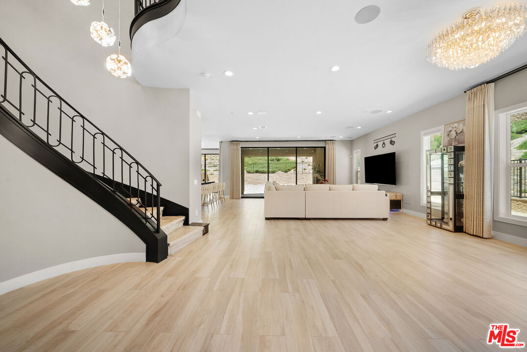 20517 Deer Grass Court Porter Ranch, CA 91326 - Photo 12 of 75 a view of a livingroom with furniture and a floor to ceiling window
