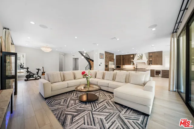 a kitchen with stainless steel appliances granite countertop a sink microwave and cabinets