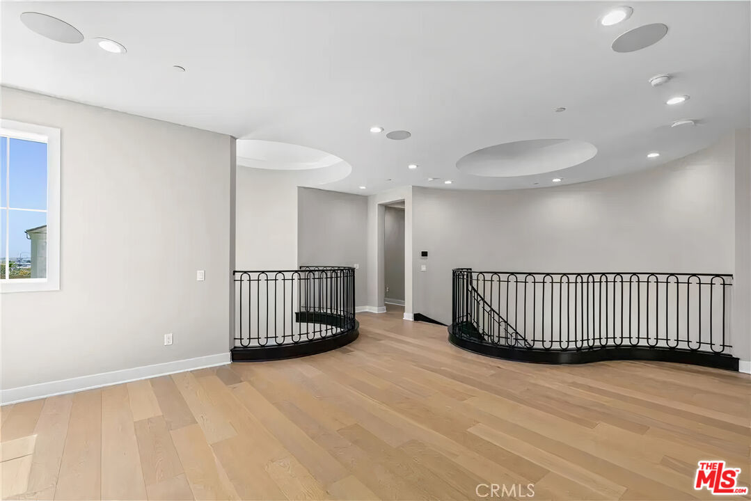 20517 Deer Grass Court Porter Ranch, CA 91326 - Photo 41 of 75 a view of a room with a wooden floor