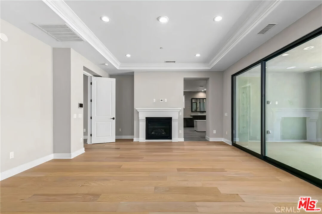 20517 Deer Grass Court Porter Ranch, CA 91326 - Photo 42 of 75 a view of an empty room with a fireplace