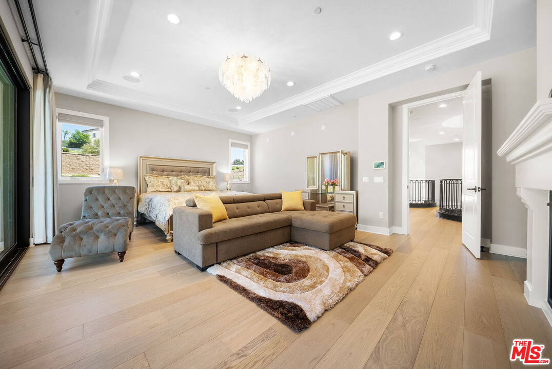 20517 Deer Grass Court Porter Ranch, CA 91326 - Photo 45 of 75 a living room with furniture and a wooden floor