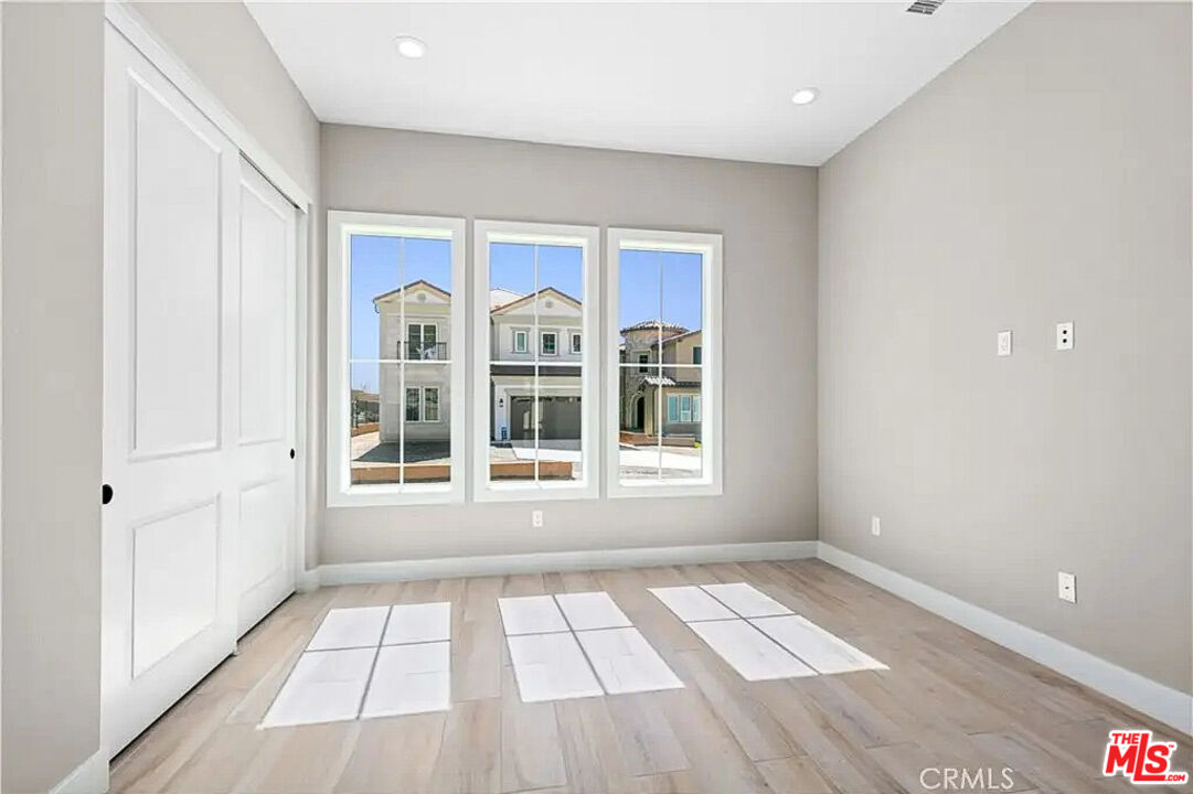 20517 Deer Grass Court Porter Ranch, CA 91326 - Photo 52 of 75 a view of empty room with windows
