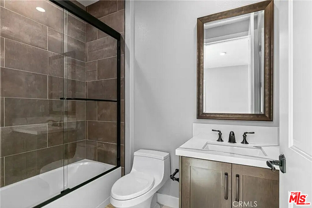 20517 Deer Grass Court Porter Ranch, CA 91326 - Photo 58 of 75 a bathroom with a sink a toilet and shower