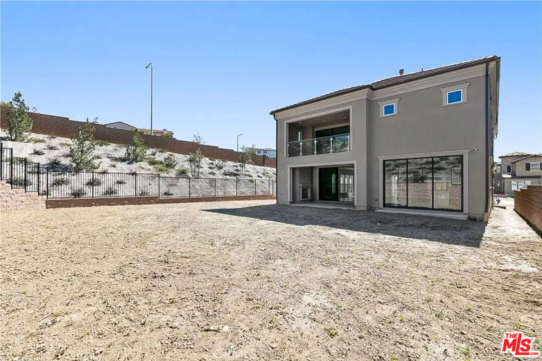 20517 Deer Grass Court Porter Ranch, CA 91326 - Photo 66 of 75 a view of a house with a yard