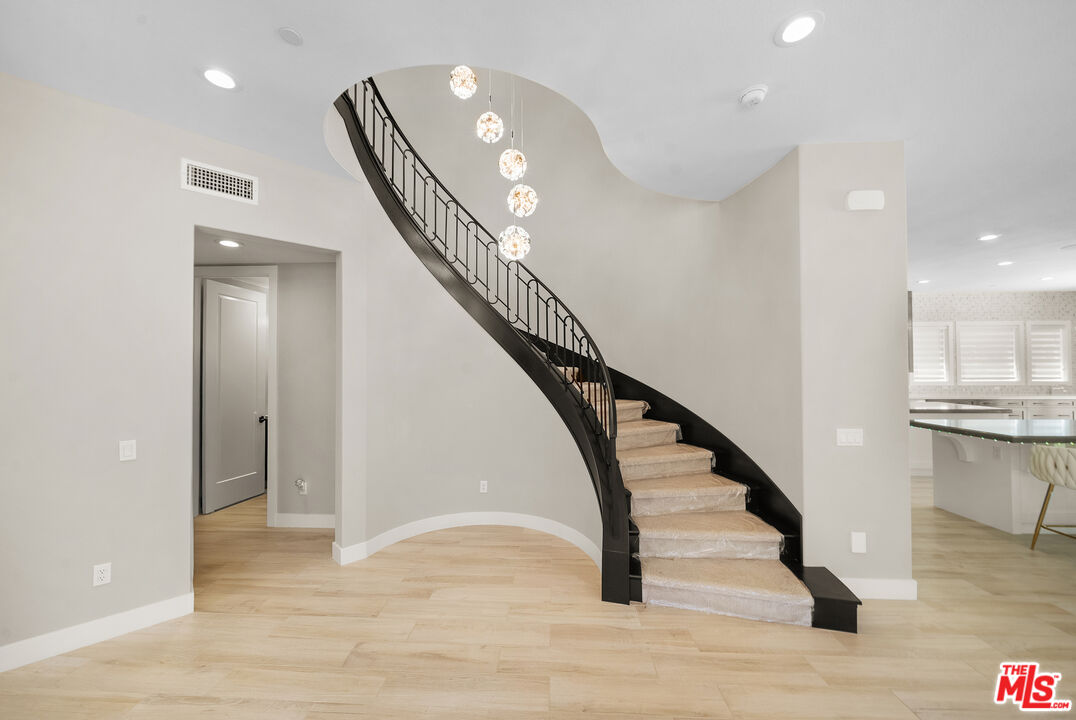 20517 Deer Grass Court Porter Ranch, CA 91326 - Photo 9 of 75 a view of entryway and hall with wooden floor