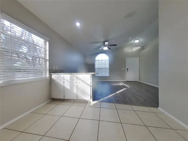 a view of a living room with a large window
