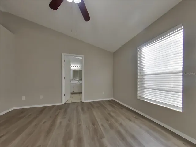 a view of room window and wooden floor