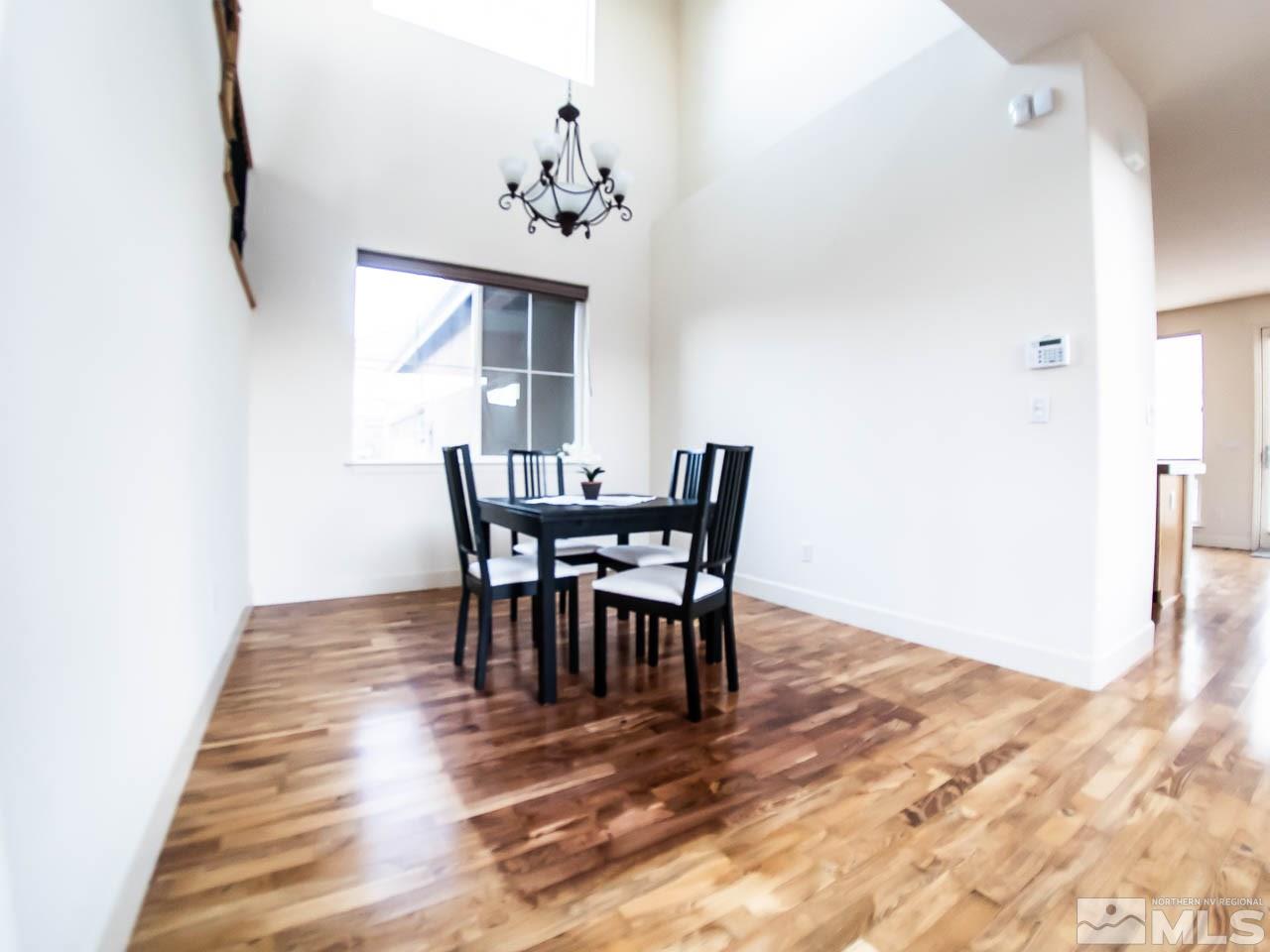 609 Rabbit Ridge Court Reno, NV 89511 - Photo 7 of 30 a view of a dining room with furniture and wooden floor