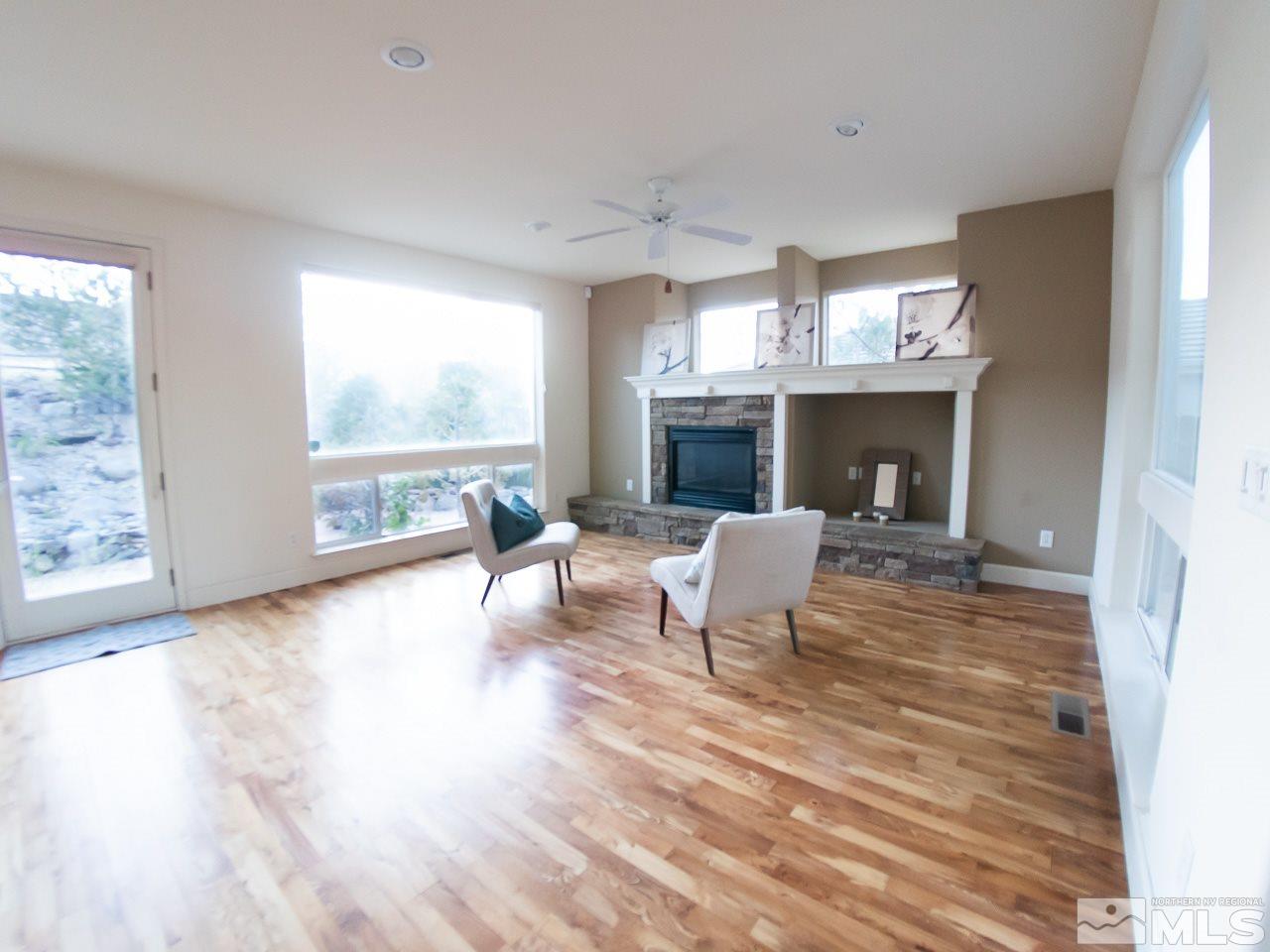609 Rabbit Ridge Court Reno, NV 89511 - Photo 8 of 30 a living room with furniture and a fireplace