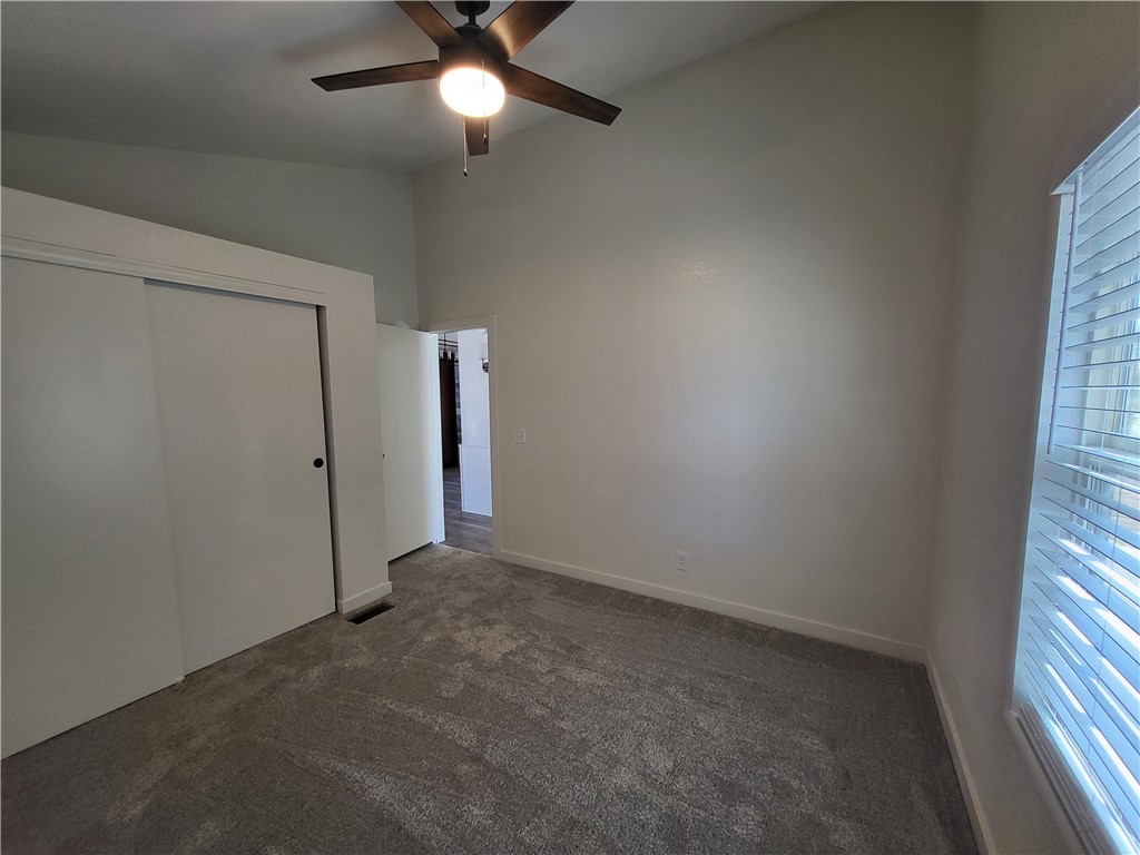 30260 Haystack Drive Meadview, AZ 86444 - Photo 25 of 52 an empty room with a window and a fan