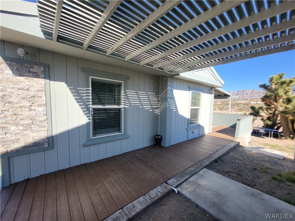 30260 Haystack Drive Meadview, AZ 86444 - Photo 30 of 52 a view of an empty room with wooden floor and a window