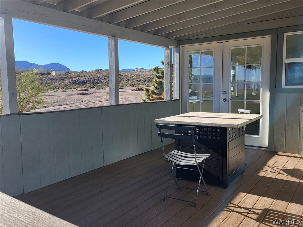 30260 Haystack Drive Meadview, AZ 86444 - Photo 34 of 52 a room with wooden floor and a table