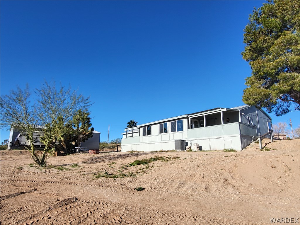 30260 Haystack Drive Meadview, AZ 86444 - Photo 39 of 52 a large building with a large tree in front of it