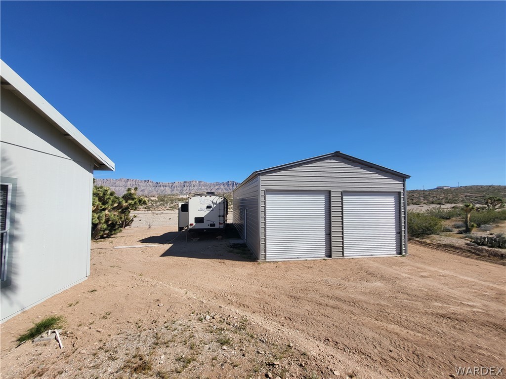 30260 Haystack Drive Meadview, AZ 86444 - Photo 45 of 52 a view of a house with a snow in the yard