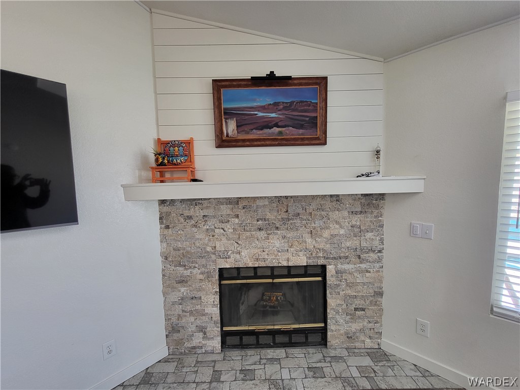 30260 Haystack Drive Meadview, AZ 86444 - Photo 8 of 52 a stone fireplace with a hallway