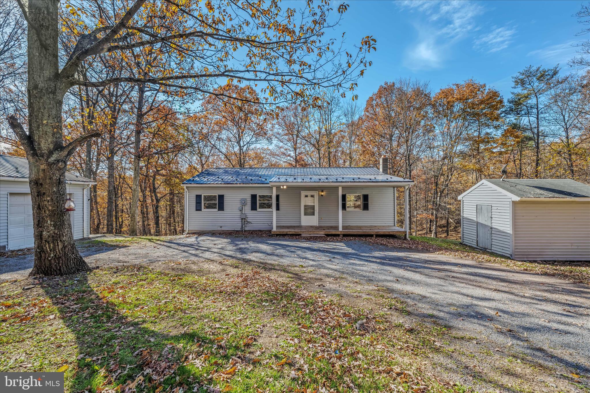 438 Gloyd Lane Great Cacapon, WV 25422 - Photo 2 of 30 a view of a house with a snow in the yard