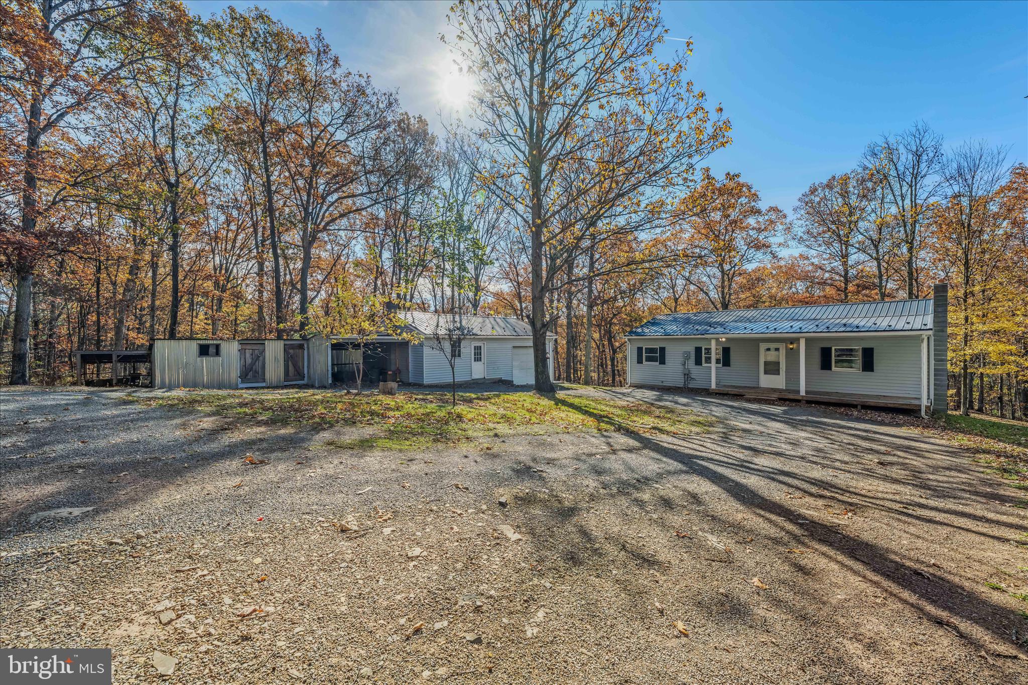 438 Gloyd Lane Great Cacapon, WV 25422 - Photo 30 of 30 a front view of a house with a yard and trees