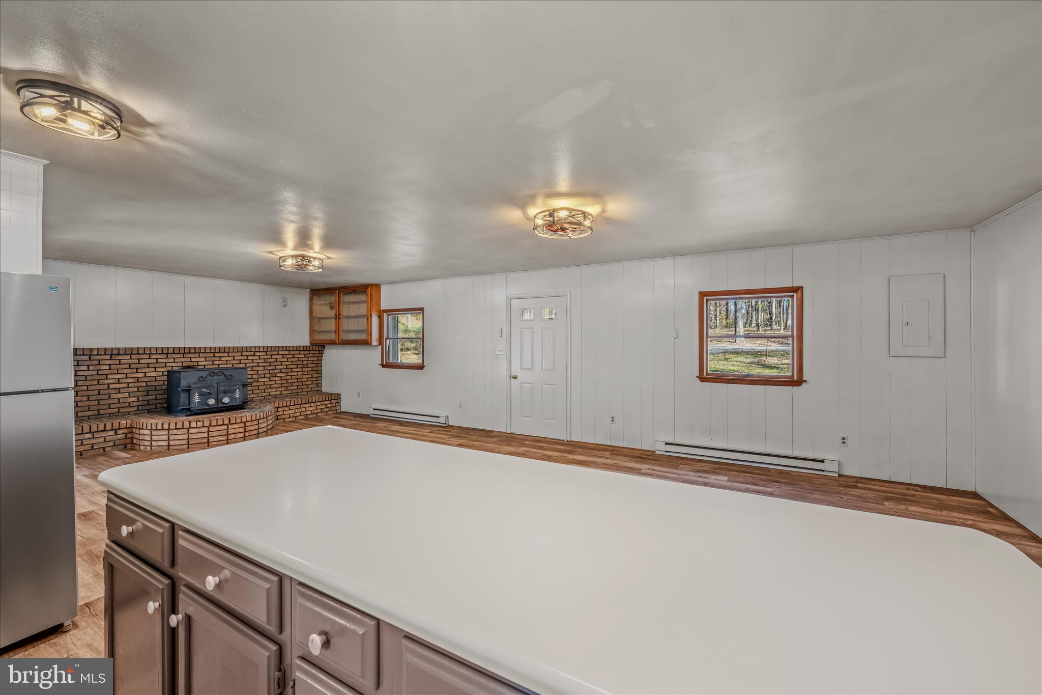 438 Gloyd Lane Great Cacapon, WV 25422 - Photo 10 of 30 a kitchen with a sink and a refrigerator