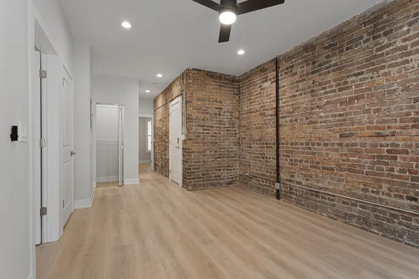 a view of empty room with a ceiling fan
