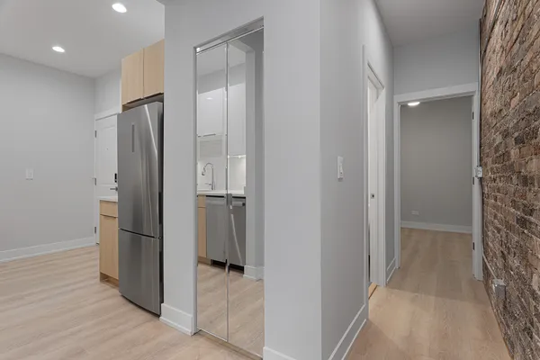 a bathroom with a shower and a glass door