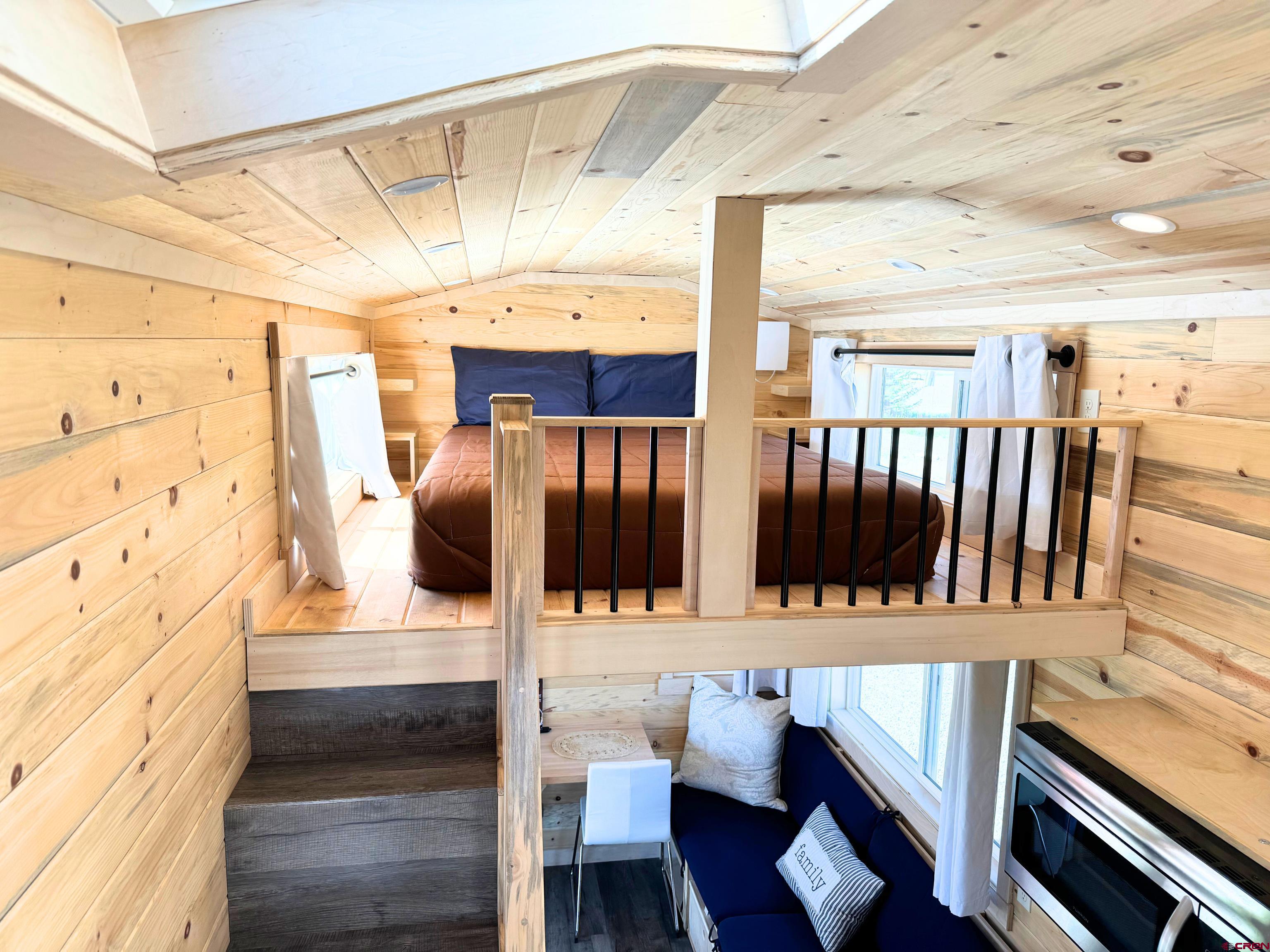 22130 6850 Road, Unit 214 Montrose, CO 81403 - Photo 14 of 26 a bathroom with a sink and mirror
