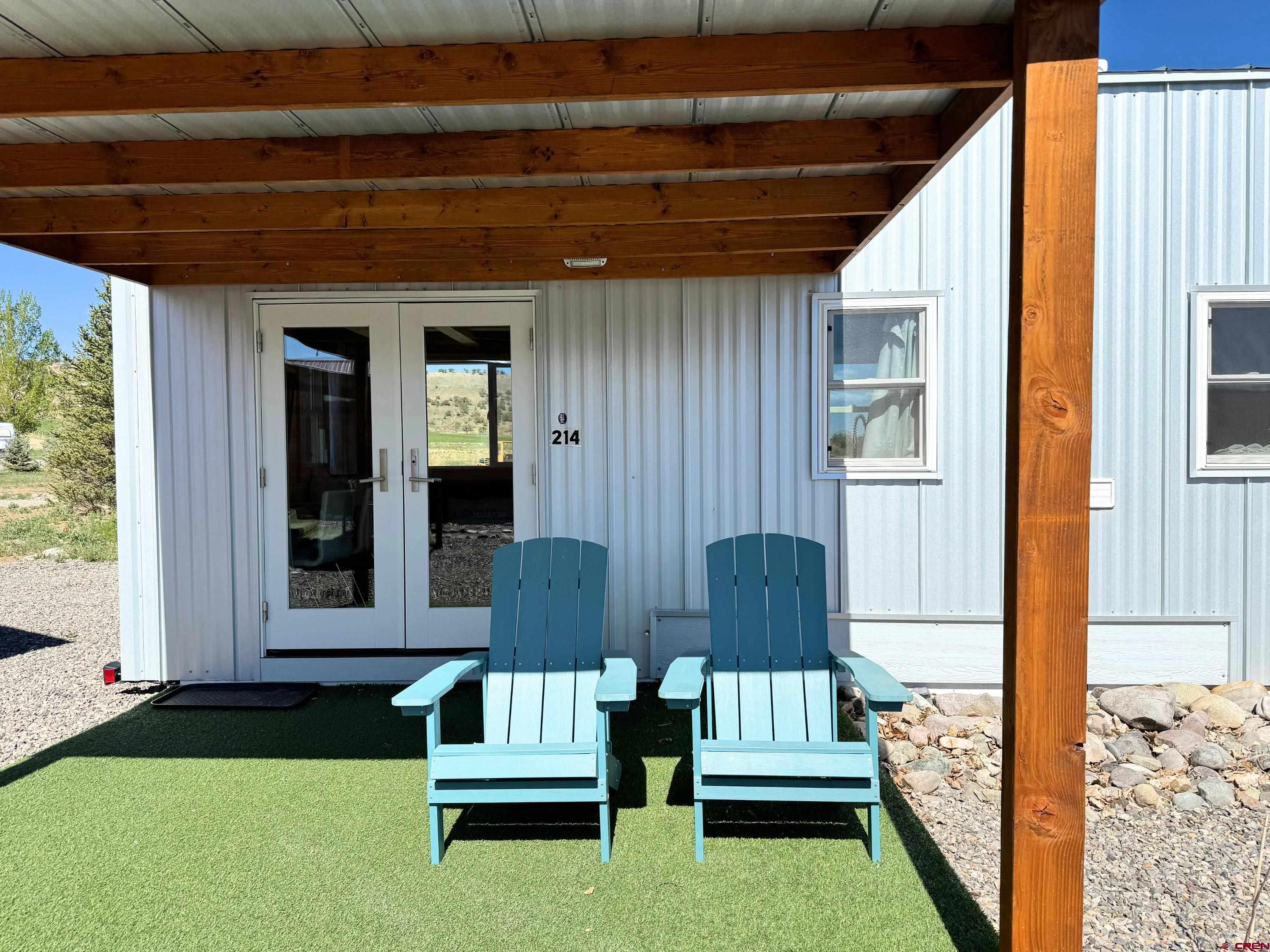 22130 6850 Road, Unit 214 Montrose, CO 81403 - Photo 17 of 26 a garden view with seating space