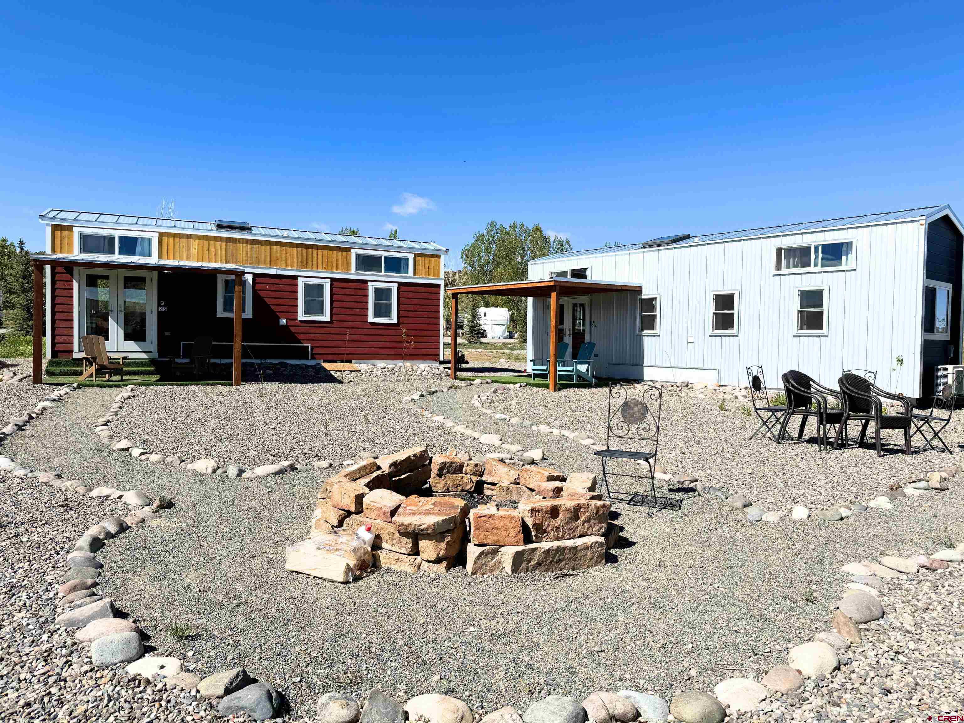 22130 6850 Road, Unit 214 Montrose, CO 81403 - Photo 18 of 26 a view of a house with patio