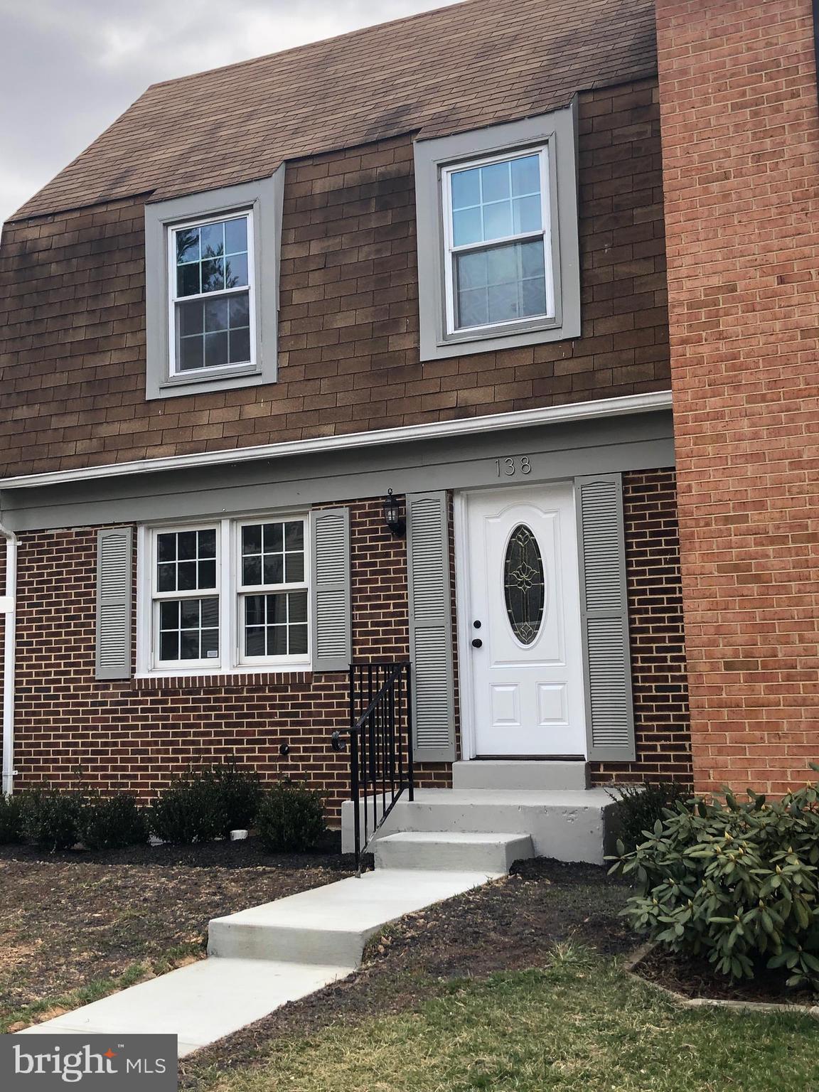Front of House with new concrete walkway and steps