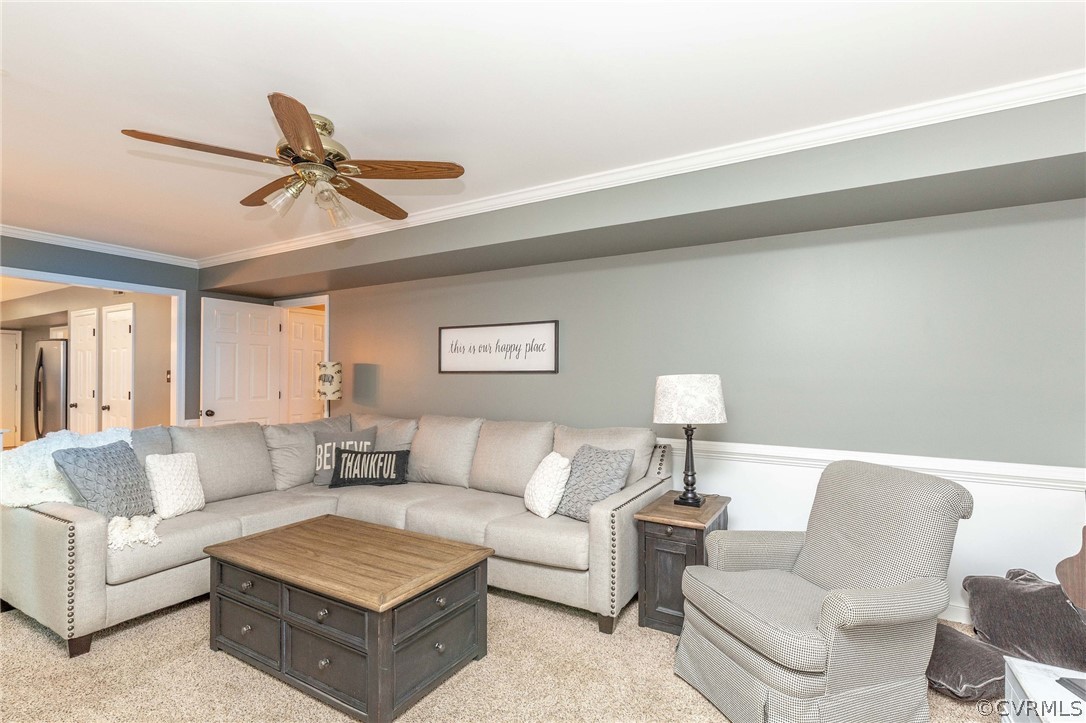 14302 Huntgate Woods Road Midlothian, VA 23112 - Photo 14 of 50 a living room with furniture and a lamp