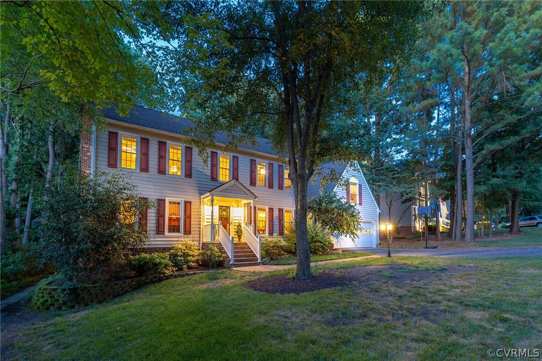 14302 Huntgate Woods Road Midlothian, VA 23112 - Photo 2 of 50 a front view of a house with a yard