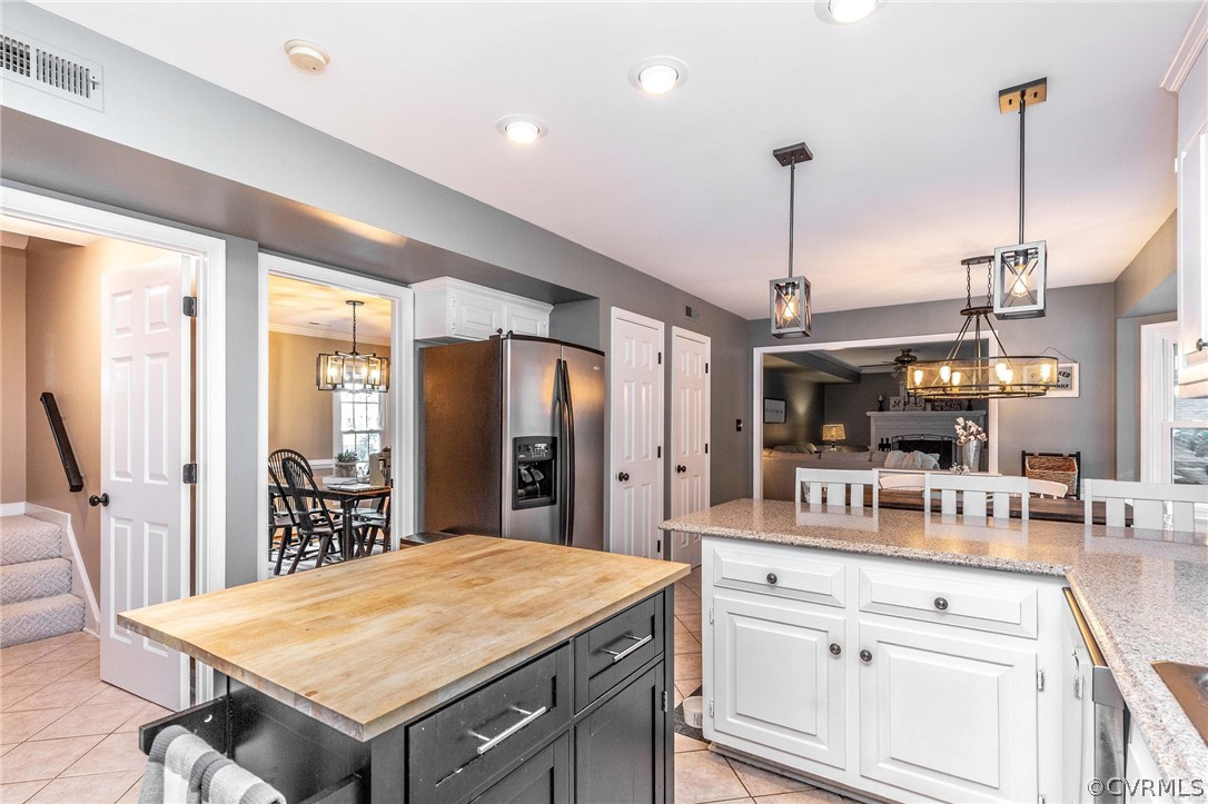 14302 Huntgate Woods Road Midlothian, VA 23112 - Photo 3 of 50 a kitchen with a table and chairs