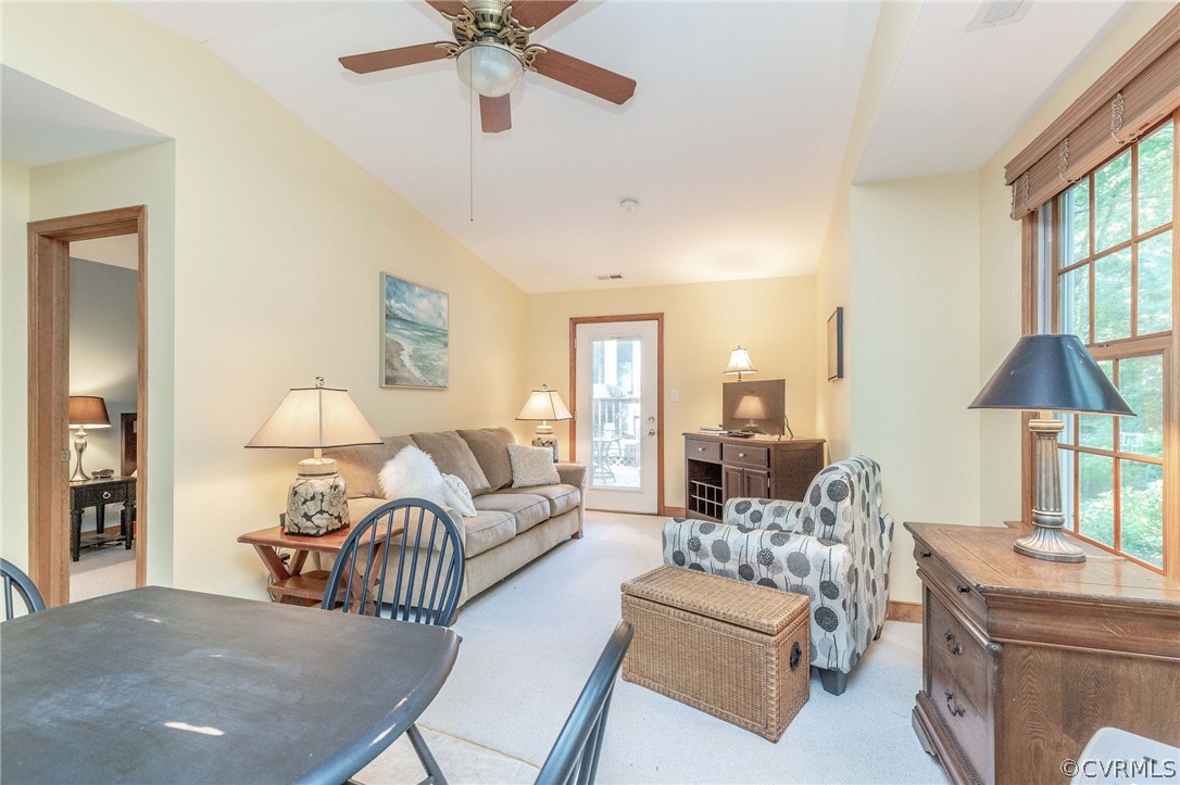 14302 Huntgate Woods Road Midlothian, VA 23112 - Photo 35 of 50 a living room with furniture and a chandelier
