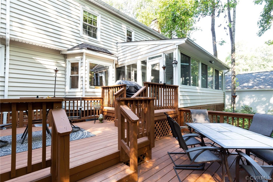 14302 Huntgate Woods Road Midlothian, VA 23112 - Photo 41 of 50 a view of a house with patio and wooden deck