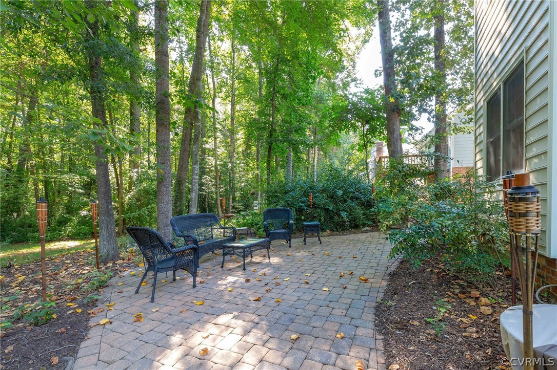 14302 Huntgate Woods Road Midlothian, VA 23112 - Photo 44 of 50 a view of a bench in a backyard