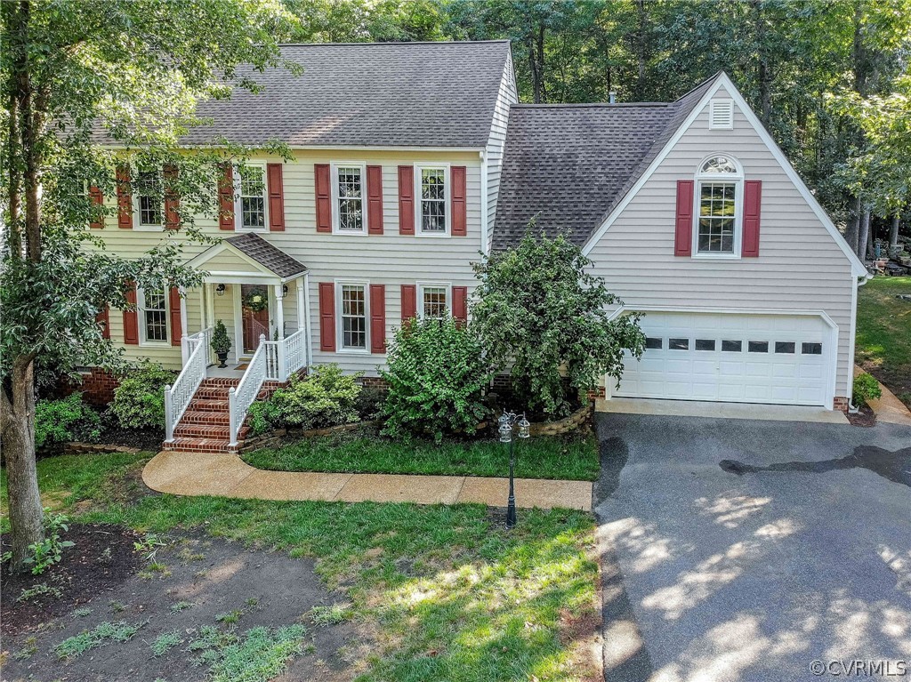14302 Huntgate Woods Road Midlothian, VA 23112 - Photo 46 of 50 a front view of a house with a yard