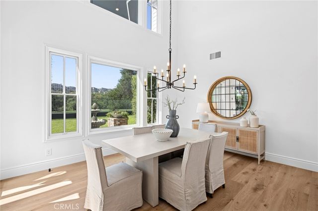 a living room with fireplace furniture and a wooden floor