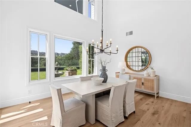 a living room with fireplace furniture and a wooden floor
