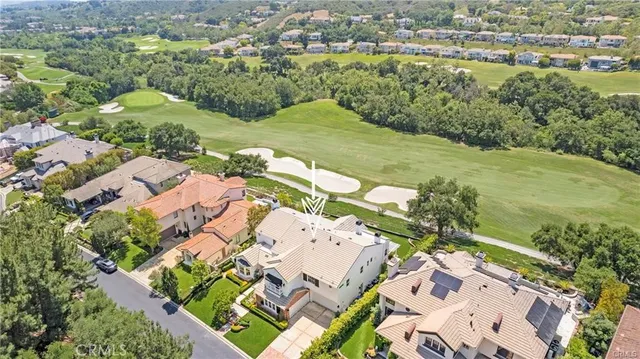 an aerial view of a house with a lake view