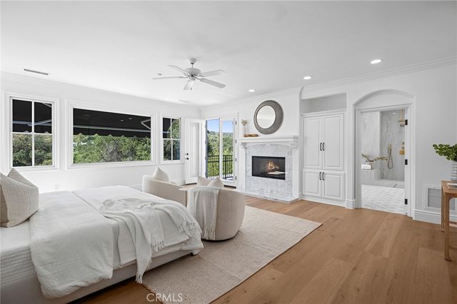 a view of a balcony with wooden floor and outdoor seating