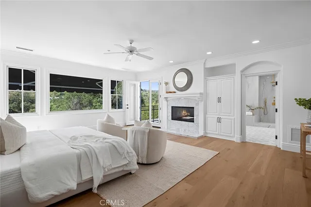 a view of a balcony with wooden floor and outdoor seating